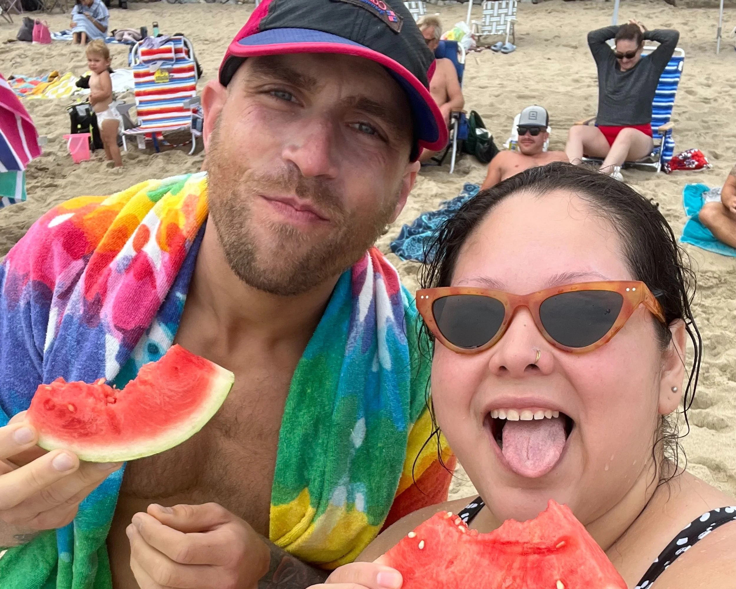 No Easy Feet members enjoying watermelon on the beach