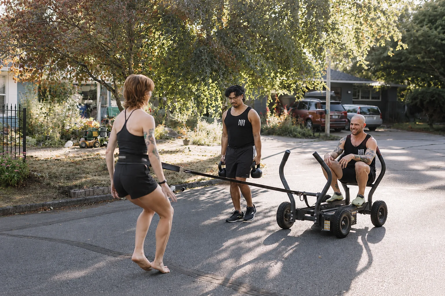 No Easy Feet members sled training on a SE Portland neighborhood street